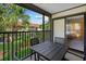 Relaxing patio offers a table set, with a verdant lawn view at 6204 Midnight Pass Rd # 201, Sarasota, FL 34242