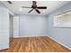 Light and airy bedroom with wood floors, closet, and a ceiling fan at 635 N Jefferson Ave # 635, Sarasota, FL 34237