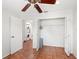 Bedroom with tile flooring, closet, and laundry area at 635 N Jefferson Ave # 635, Sarasota, FL 34237