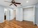 Bright bedroom featuring wood floors, ceiling fan, and closet at 635 N Jefferson Ave # 635, Sarasota, FL 34237