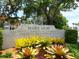 A beautiful entrance to Marie Selby Botanical Gardens, surrounded by lush greenery and vibrant flowers at 635 N Jefferson Ave # 635, Sarasota, FL 34237