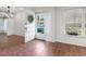 Bright foyer with tile flooring, wreath on front door, and natural light streaming through the window at 635 N Jefferson Ave # 635, Sarasota, FL 34237