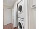 Convenient laundry area with stacked washer and dryer, plus storage at 635 N Jefferson Ave # 635, Sarasota, FL 34237