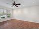 Bright open space with tiled flooring, ceiling fan, and large window, perfect for relaxing or entertaining guests at 635 N Jefferson Ave # 635, Sarasota, FL 34237