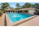 Community pool with ample seating and shaded lounge area at 635 N Jefferson Ave # 635, Sarasota, FL 34237