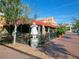 Inviting restaurant exterior featuring an outdoor seating area under a red awning at 635 N Jefferson Ave # 635, Sarasota, FL 34237