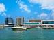Waterfront with boats docked and buildings in the background with blue sky and clouds at 635 N Jefferson Ave # 635, Sarasota, FL 34237
