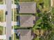 Stunning aerial view of the house showcasing backyard landscaping with mature tree coverage at 6356 Mighty Eagle Way, Sarasota, FL 34241