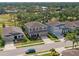 Beautiful aerial view showcasing the house in a lush, green neighborhood with mature trees at 6356 Mighty Eagle Way, Sarasota, FL 34241