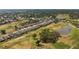 Gorgeous aerial view of a community located on a golf course with mature tree coverage at 6356 Mighty Eagle Way, Sarasota, FL 34241