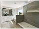 Luxurious bathroom with a soaking tub, walk-in shower, double vanity, and modern fixtures at 6356 Mighty Eagle Way, Sarasota, FL 34241