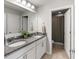 Modern bathroom features double sinks, granite countertops, and a separate shower room at 6356 Mighty Eagle Way, Sarasota, FL 34241