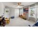 Bedroom with multiple windows, carpet, and play area at 6356 Mighty Eagle Way, Sarasota, FL 34241