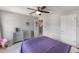 Cozy bedroom with a ceiling fan, dresser, and closet space, offering a relaxing retreat at 6356 Mighty Eagle Way, Sarasota, FL 34241