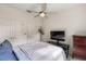 Comfortable bedroom with a ceiling fan, closet, tv, and dresser, providing a cozy retreat at 6356 Mighty Eagle Way, Sarasota, FL 34241
