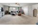 Spacious bonus room featuring plush carpeting, ceiling fan, and plenty of space for entertaining and relaxing at 6356 Mighty Eagle Way, Sarasota, FL 34241
