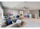 Spacious bonus room with a comfortable couch and lots of room for activities at 6356 Mighty Eagle Way, Sarasota, FL 34241