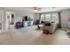 Spacious bonus room with comfortable seating, media center, and ample natural light at 6356 Mighty Eagle Way, Sarasota, FL 34241
