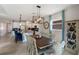 Bright Dining Room with a stylish chandelier, seating for six, and seamless flow to the modern kitchen at 6356 Mighty Eagle Way, Sarasota, FL 34241
