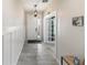Inviting entryway with tile floors, wainscoting, and a view of the front door and bonus room at 6356 Mighty Eagle Way, Sarasota, FL 34241