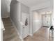 Inviting entryway with wooden floors and a staircase leading to the upper level at 6356 Mighty Eagle Way, Sarasota, FL 34241