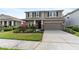 Charming two-story home with a manicured lawn and a two-car garage, perfect for Gathering living at 6356 Mighty Eagle Way, Sarasota, FL 34241