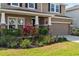 Charming two-story home featuring a well-manicured lawn and a two-car garage at 6356 Mighty Eagle Way, Sarasota, FL 34241