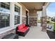 Inviting front porch with decorative stone accents, perfect for relaxing with outdoor furniture at 6356 Mighty Eagle Way, Sarasota, FL 34241