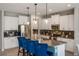 Bright kitchen featuring a central island with bar seating and modern appliances for culinary enthusiasts at 6356 Mighty Eagle Way, Sarasota, FL 34241