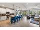 Open floor plan showcasing kitchen with island seating, dining area, and cozy living space at 6356 Mighty Eagle Way, Sarasota, FL 34241