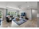 Bright living room with large windows, plush seating, and stylish decor creating an inviting atmosphere at 6356 Mighty Eagle Way, Sarasota, FL 34241