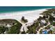 Beautiful beach community showcasing lush landscapes, white sand, and turquoise waters, promising a serene coastal lifestyle at 681 Avenida De Mayo, Sarasota, FL 34242