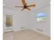 Bright bedroom boasts tile floors, recessed lighting, and backyard access via a glass door for outdoor enjoyment at 681 Avenida De Mayo, Sarasota, FL 34242