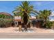 Charming home with a brick driveway, mature palm trees, and a private courtyard with a screened pool at 681 Avenida De Mayo, Sarasota, FL 34242