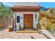 Charming home featuring a beautiful wood double door entry with brick and rock details at 681 Avenida De Mayo, Sarasota, FL 34242