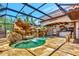 Outdoor pool and bar area, featuring an attractive waterfall, bar and overhead covering at 681 Avenida De Mayo, Sarasota, FL 34242