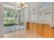 Bright breakfast nook with a sliding door to the patio and natural light from plantation shutters at 7124 Rue De Palisades # 21, Sarasota, FL 34238