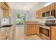 Beautiful kitchen featuring stainless steel appliances, granite countertops, and a view to the patio at 7124 Rue De Palisades # 21, Sarasota, FL 34238