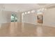 Spacious living room featuring tile floors, an open floor plan, and sliding glass doors to the lanai at 7124 Rue De Palisades # 21, Sarasota, FL 34238