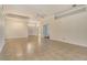 Bright living room boasts tile flooring, recessed lighting, and a ceiling fan at 7124 Rue De Palisades # 21, Sarasota, FL 34238
