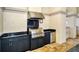 Outdoor kitchen with stainless steel BBQ, granite counter, and cabinets at 7124 Rue De Palisades # 21, Sarasota, FL 34238