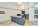 Stylish outdoor kitchen featuring stainless steel appliances, granite countertops, and ample counter space at 7124 Rue De Palisades # 21, Sarasota, FL 34238