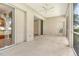 Expansive patio features a ceiling fan, screened windows, and multiple access points at 7124 Rue De Palisades # 21, Sarasota, FL 34238