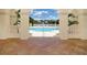 Beautiful community pool area with a white fence, lounge chairs, and well-maintained landscaping at 7124 Rue De Palisades # 21, Sarasota, FL 34238