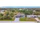 Stunning aerial view of the home showing mature trees, large driveway, and manicured front yard at 7152 Bougainvillea St, Englewood, FL 34224