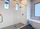 Contemporary bathroom featuring a glass shower, soaking tub and gold accents at 7152 Bougainvillea St, Englewood, FL 34224