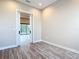 Bedroom with wood floors and sliding door leading to a pool at 7152 Bougainvillea St, Englewood, FL 34224
