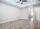 Spacious bedroom features wood flooring, recessed lighting and ceiling fan at 7152 Bougainvillea St, Englewood, FL 34224