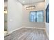 Bright dining room with a contemporary chandelier and large windows offering great natural light at 7152 Bougainvillea St, Englewood, FL 34224