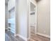 Hallway featuring recessed display shelves and luxury vinyl plank flooring at 7152 Bougainvillea St, Englewood, FL 34224